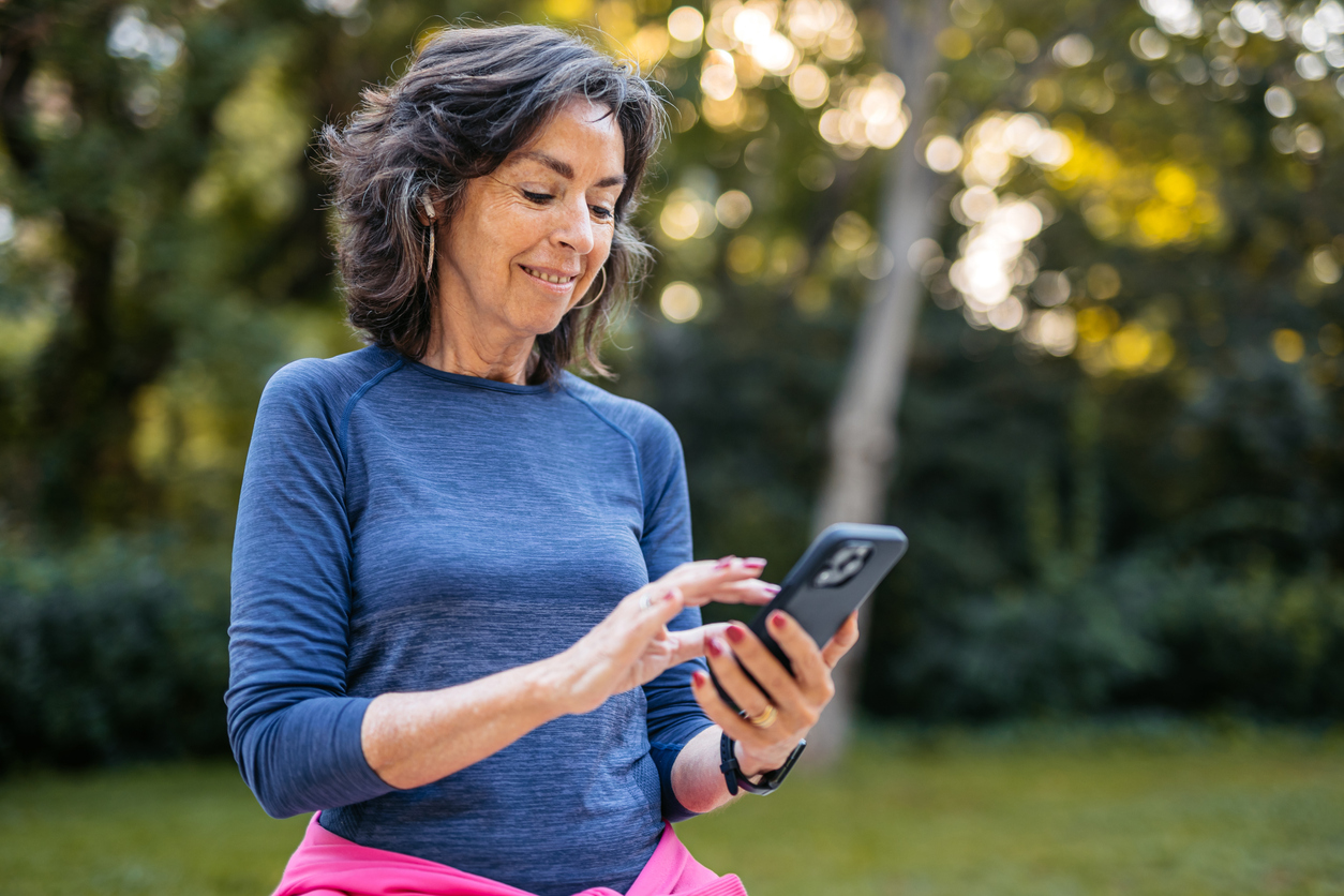 Woman using phone outdoors